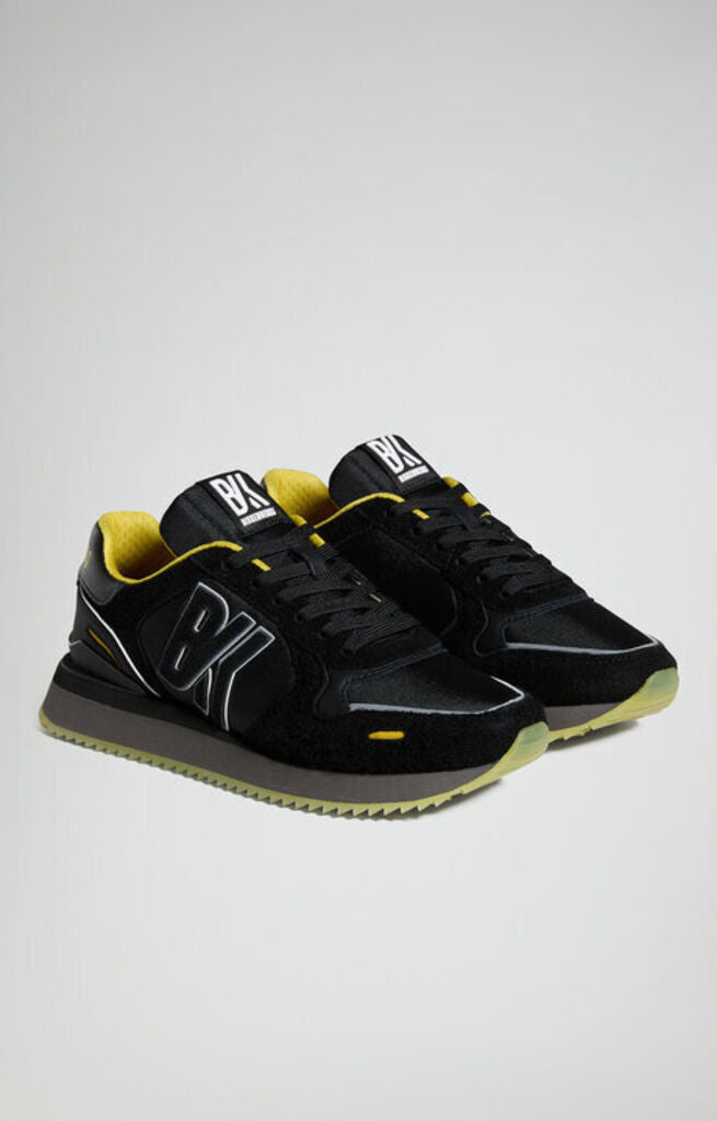 Black Textured Sneakers with Yellow Accents