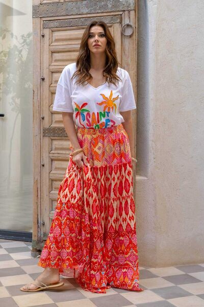 White Print Tee and Red Patterned Maxi Skirt