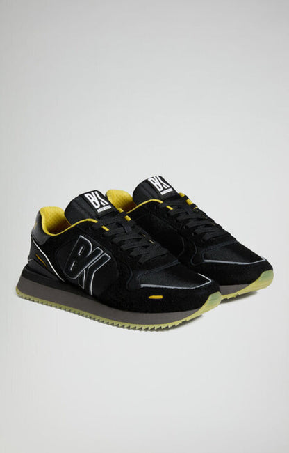 Black Textured Sneakers with Yellow Accents
