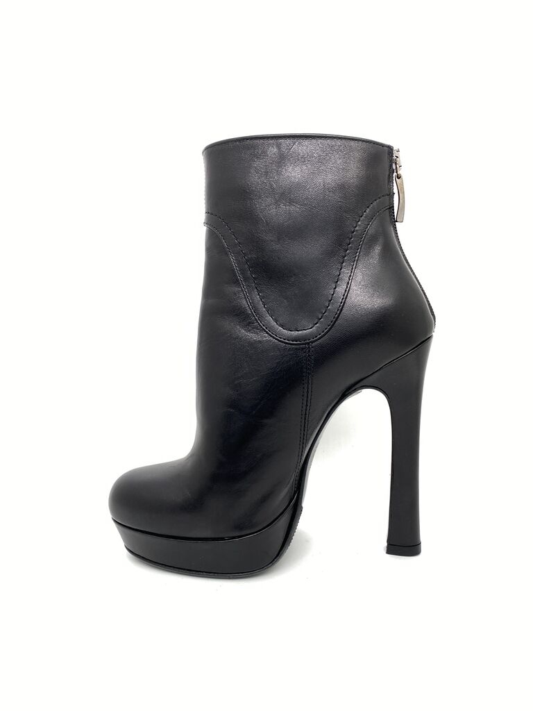 Black Leather Ankle Boots with Decorative Emblem