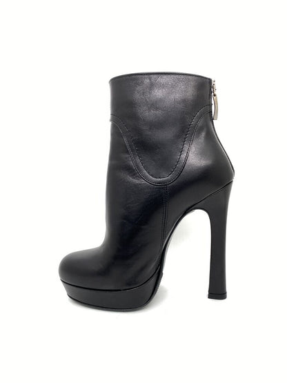 Black Leather Ankle Boots with Decorative Emblem
