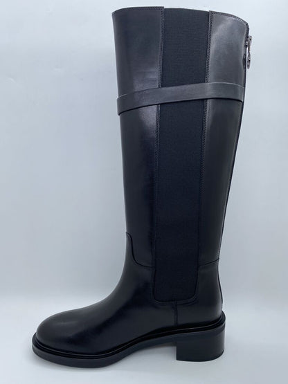 Black Knee-High Boot with Decorative Emblem